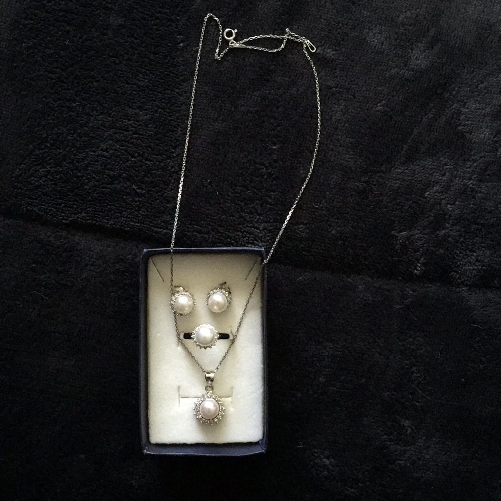 Earrings, ring, and necklace